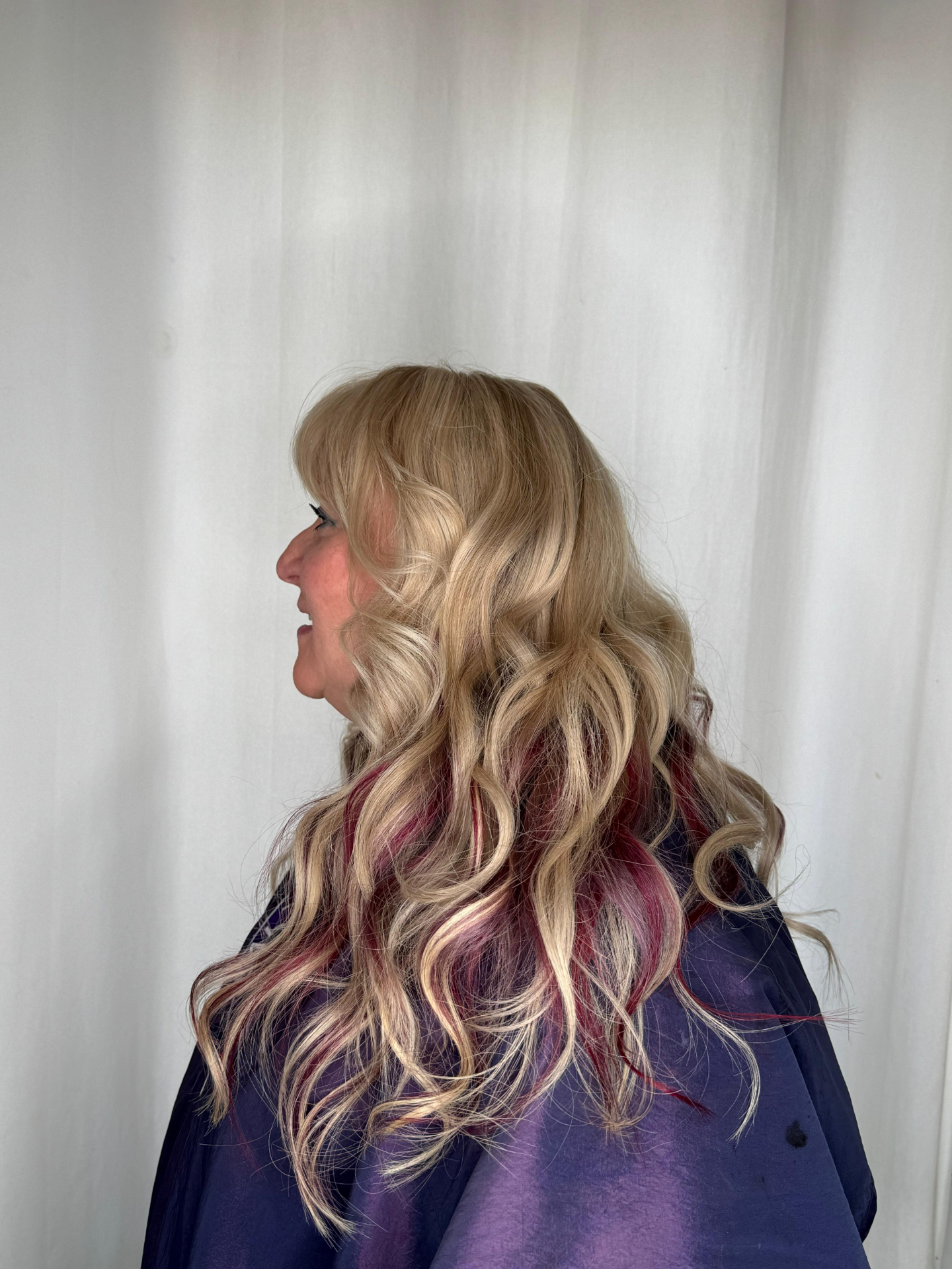 Client with full, voluminous blonde hair after Replica Scalp treatment